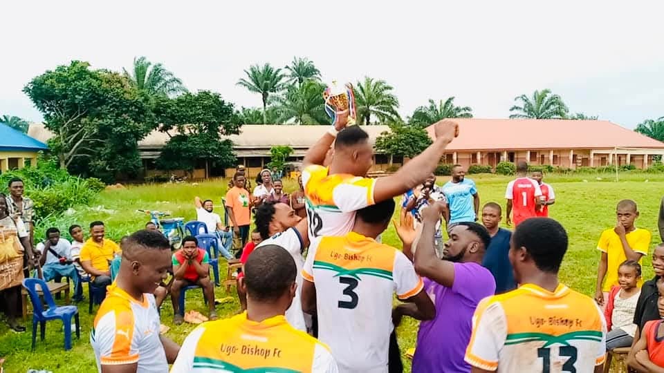 Winning team celebrating with trophy